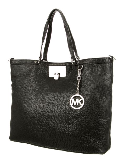 michael kors old handbags black pebble leather|Michael Kors cross over bag.